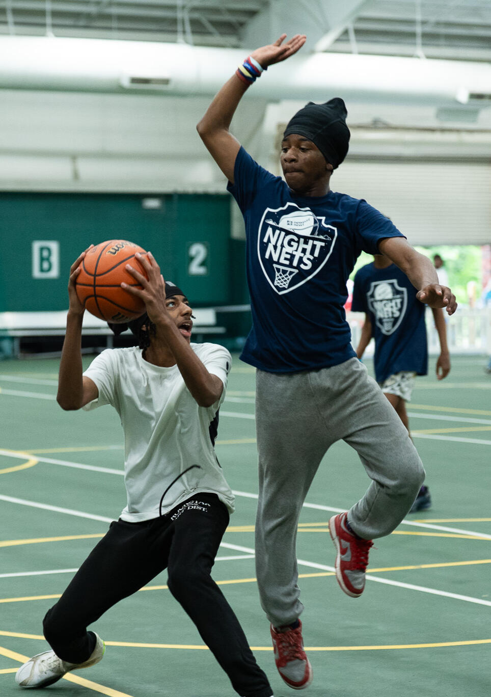 Teen basketball player posing with basketball
